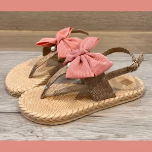 Printed sole flat sandals with large bow and pearl drop